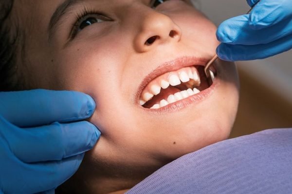Close up of dentist during a dental intervention